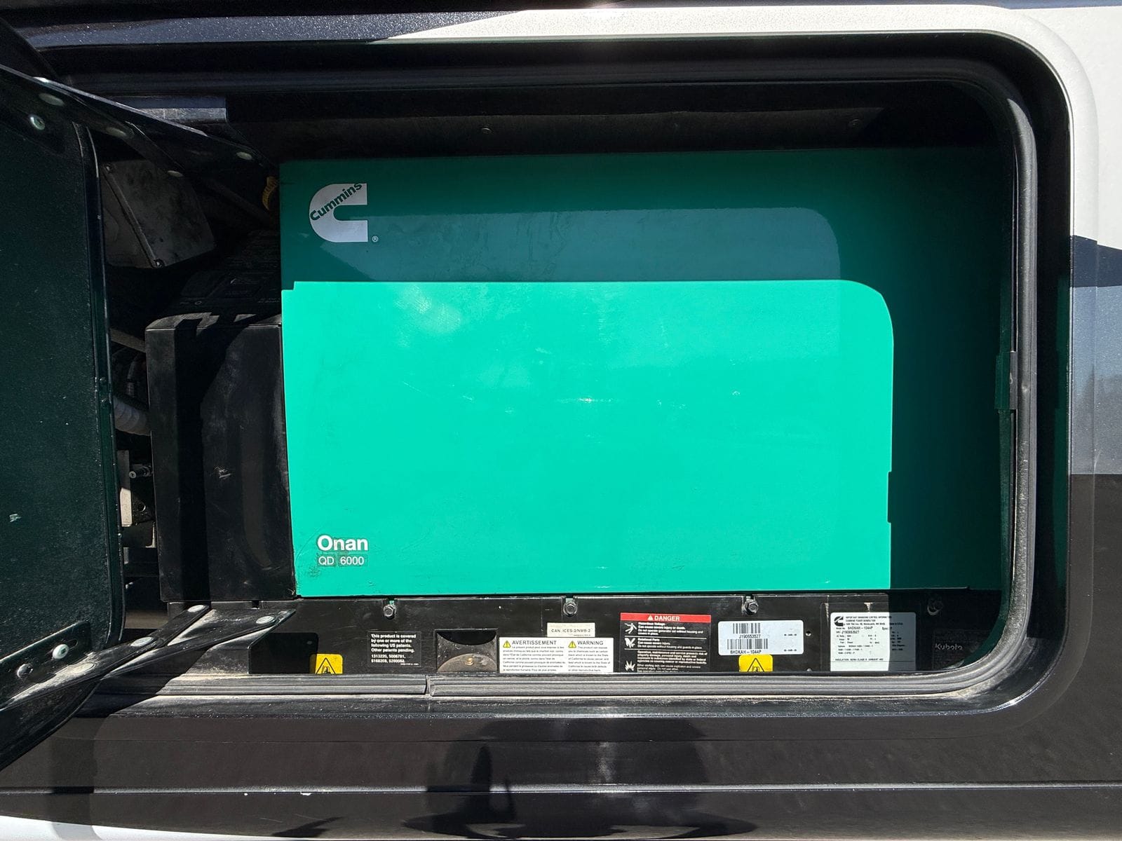 2020 Thor Magnitude BH35 generator bay, showing the Cummins Onan QD 6000 diesel generator and its data plate