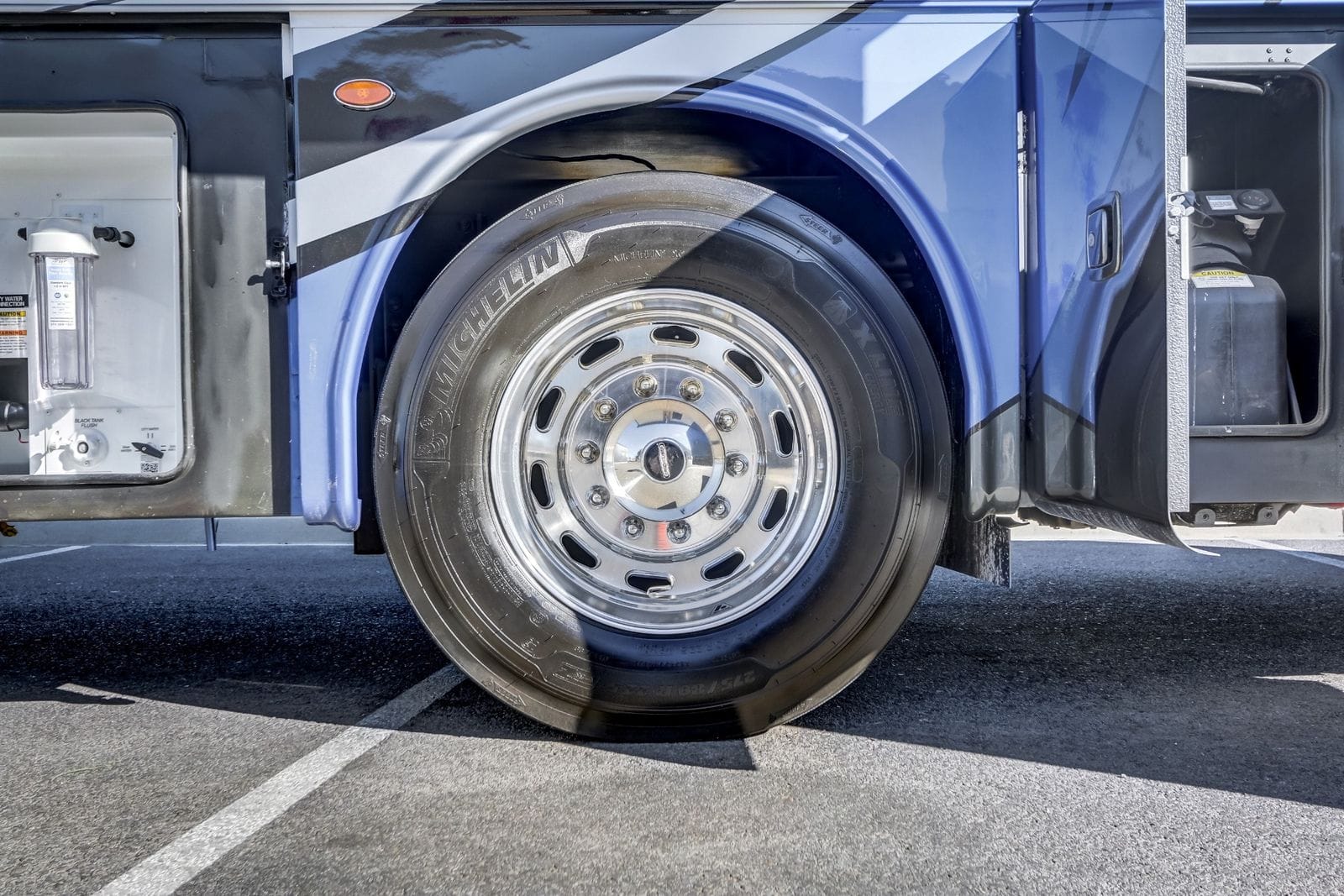 2024 Forest River Berkshire XL 40E polished aluminum front wheel with Michelin 275/80R22.5 steer tire on the Freightliner XCR chassis