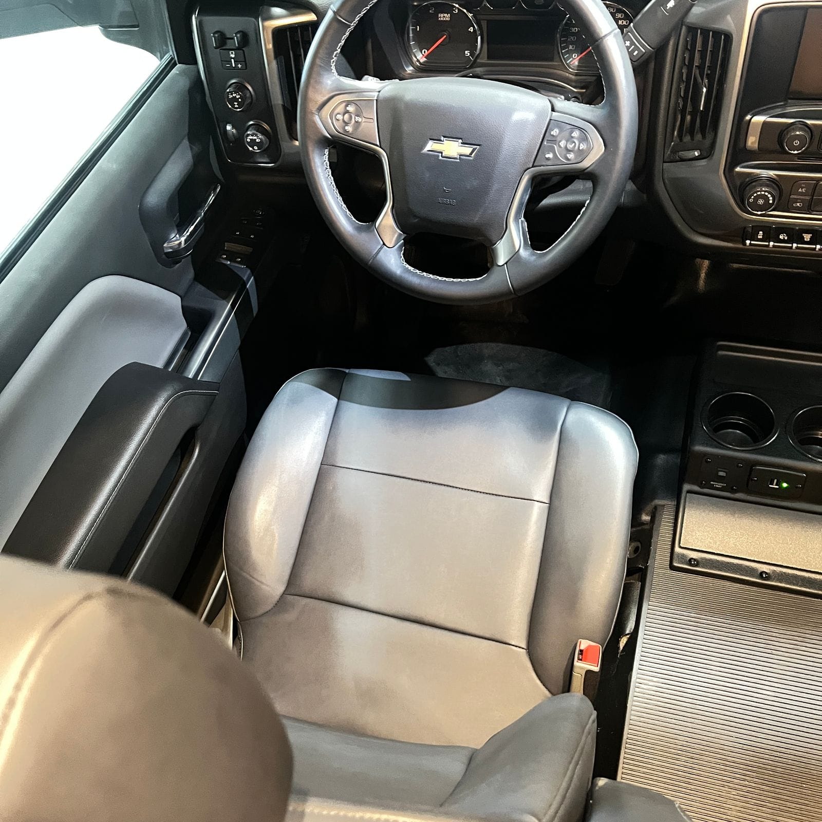 2026 Nexus Rebel 35R driver seat and steering wheel in grey leather with Chevrolet airbag cover, analog gauge cluster and centre console controls