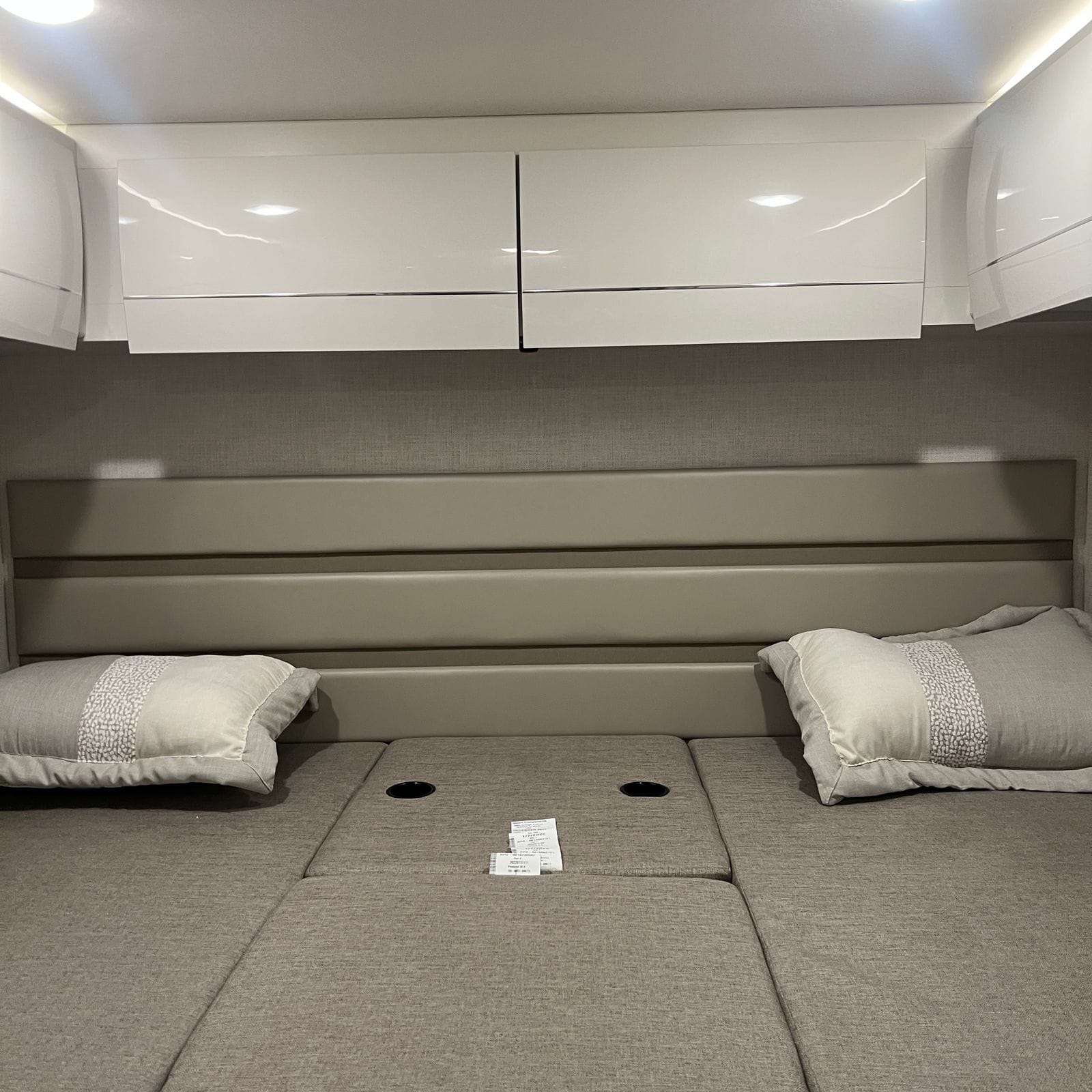 2026 Thor Delano 24XL wider view of the king-conversion bed showing the full mattress platform, padded headboard panels and recessed ceiling lights