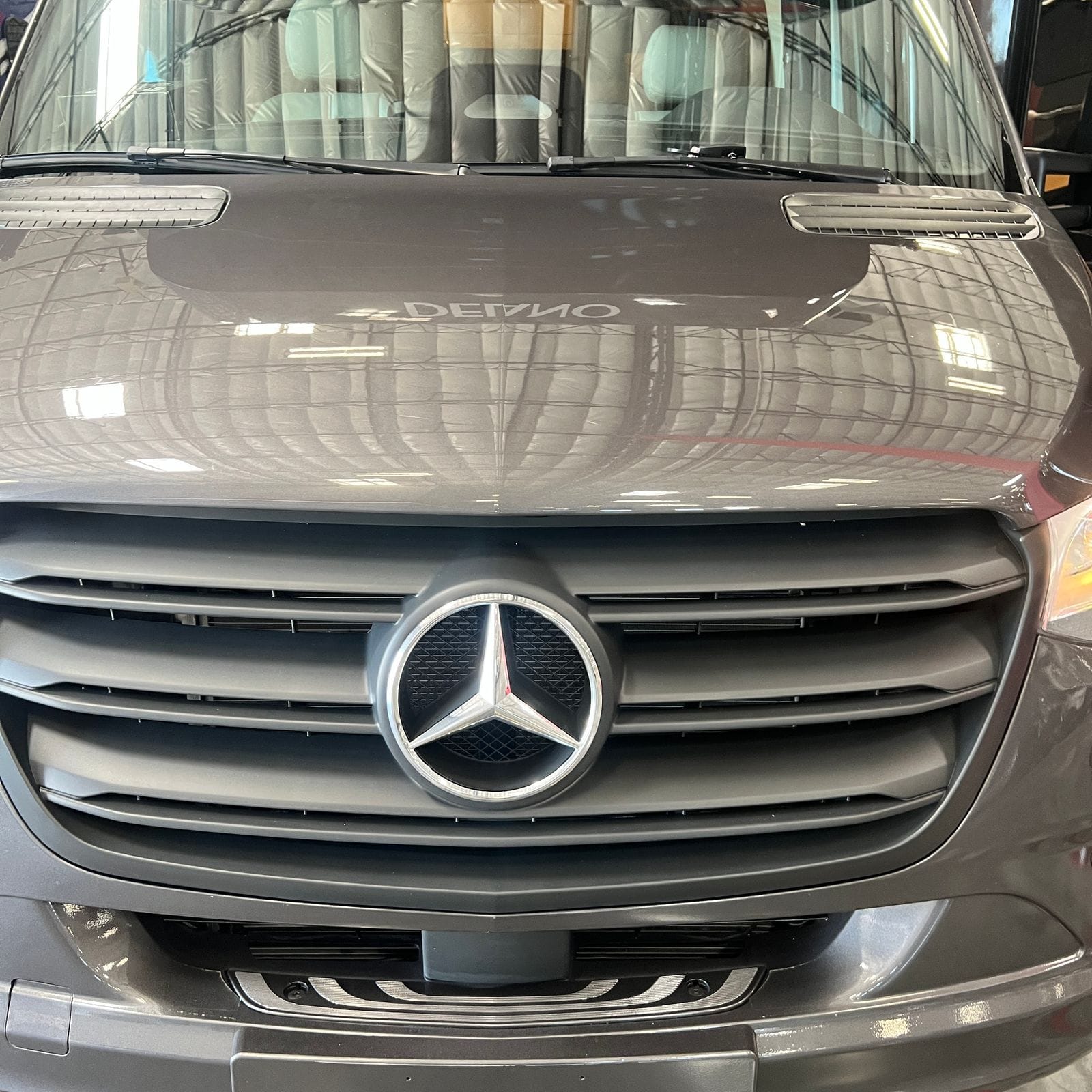 2026 Thor Delano 24XL close-up of the grey Sprinter hood and chrome Mercedes-Benz star grille badge