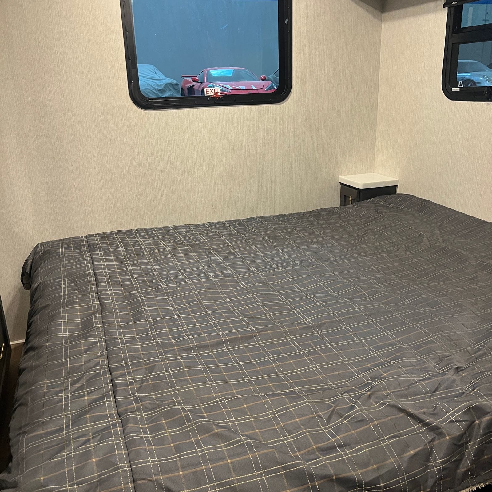 2027 Nexus Ghost 36DS bedroom window and nightstand