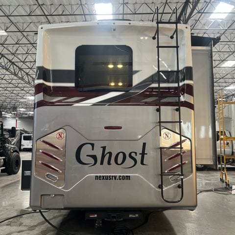 2027 Nexus Ghost 36DS cab side, International MV badge - thumbnail