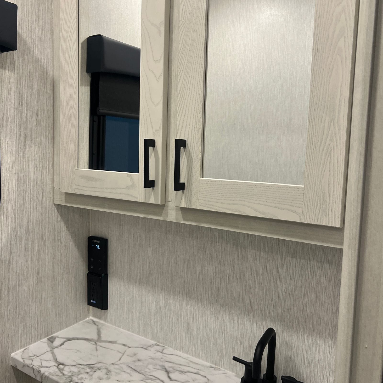 2027 Nexus Rebel 34R bathroom mirror cabinet and marble counter