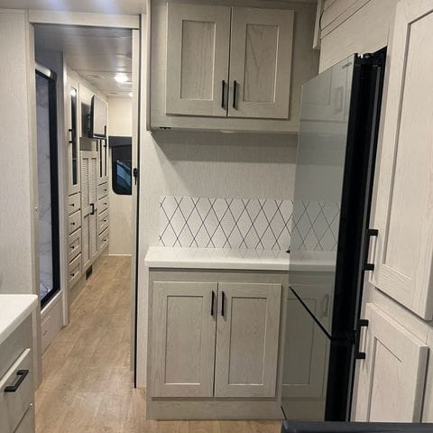 2027 Nexus Rebel 34R kitchen cabinets and backsplash - thumbnail