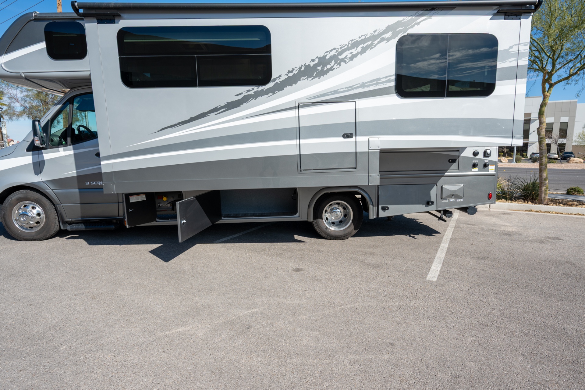 2025 Dynamax Isata 3 24FW passenger side with generator bay open