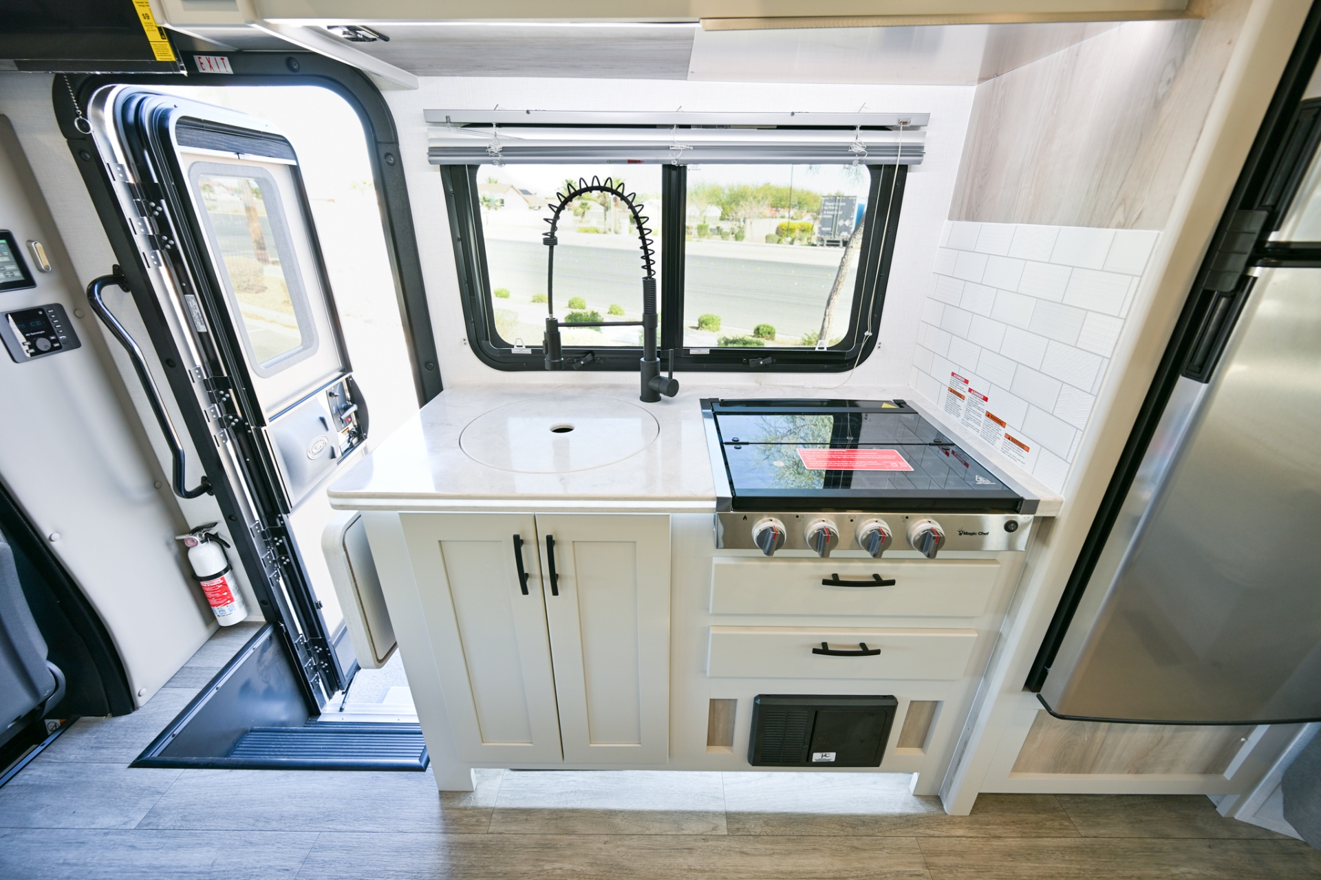 2025 Dynamax Isata 3 24FW kitchen with sink and cooktop