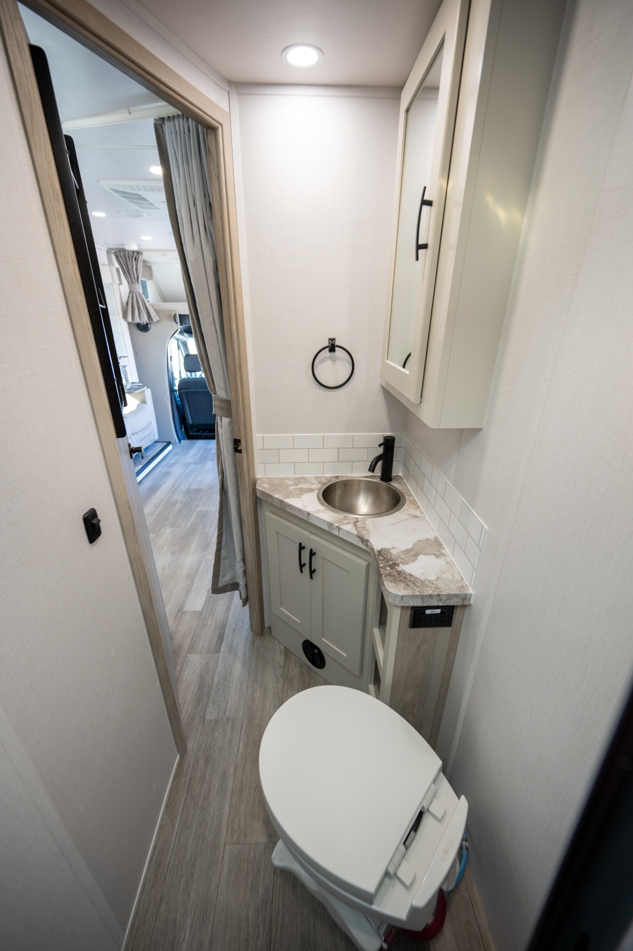 2025 Dynamax Isata 3 24FW bathroom with sliding door to living area