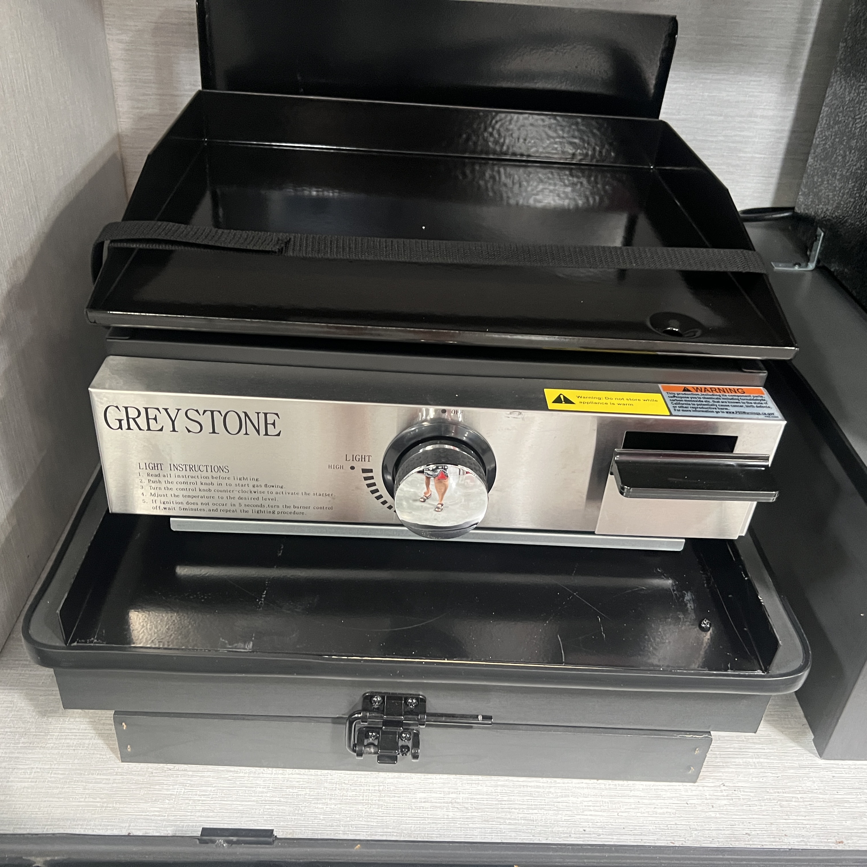 2027 Nexus Rebel Air 35R exterior griddle in outdoor galley compartment