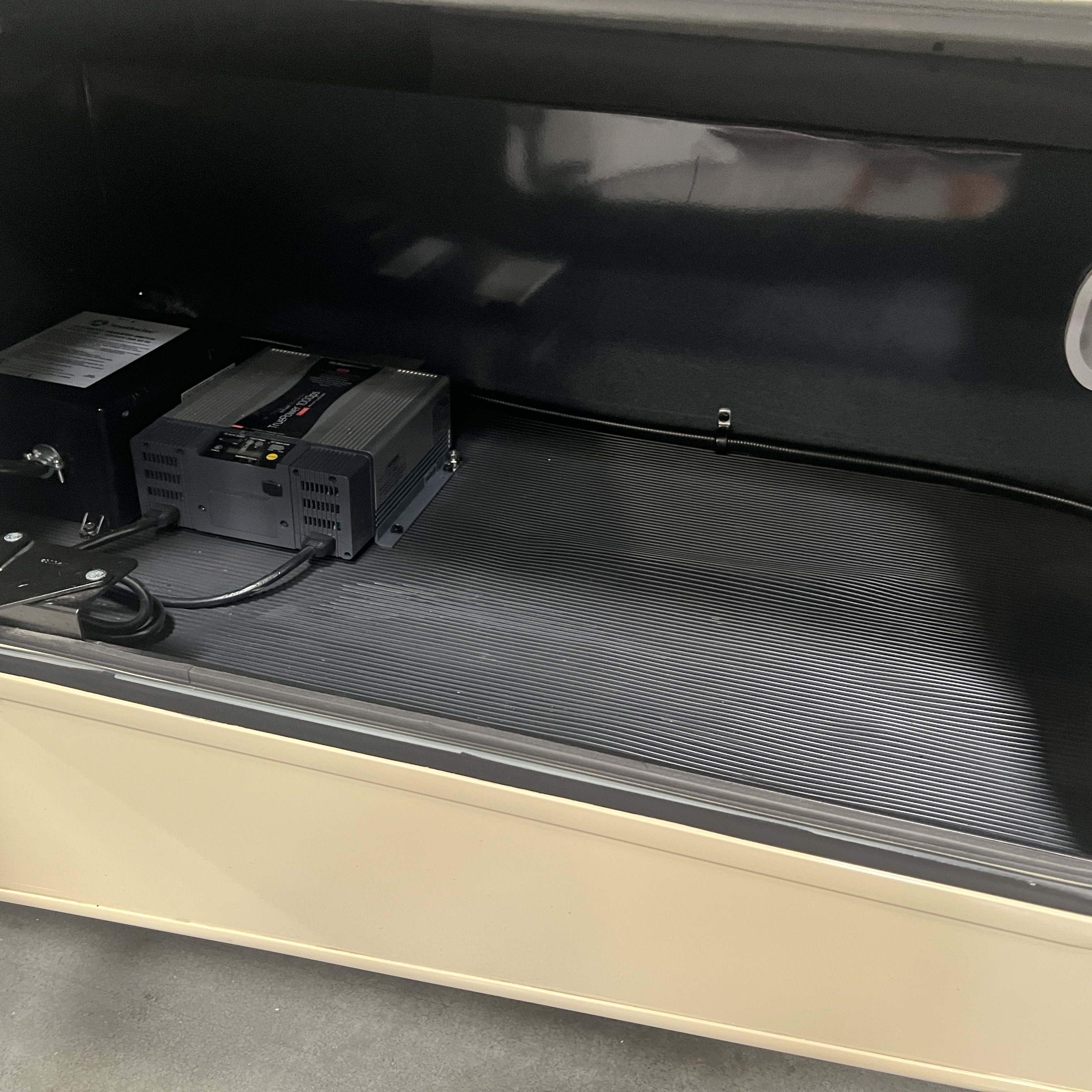 2027 Nexus Rebel Air 35R exterior storage bay with power inverter